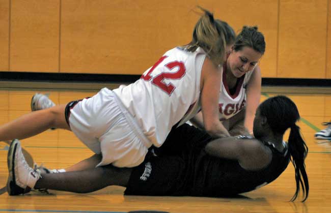 ww_bb Two members of the women's Eagles fight for the ball during their season opening exhibition game against Douglas College. (Alex Nkrumah photo)