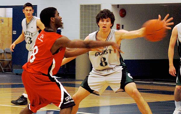 bb_oct12_1 Brighton Gbazaria, Eagles guard, competes with a Quest player for the ball during Kwantlen’s second game of the Blues Classic Basketball Tournament. The annual tournament, in its 14th year, was held at Capilano University this weekend. (Sandy Buemann photo)
