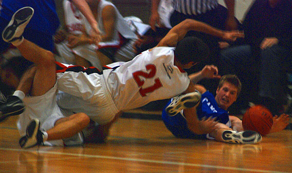 bballfall Omid Davani gets tangled with a teammate as he leaps for the ball as the Kwantlen Eagles play Camosun College on Saturday, Oct. 18.