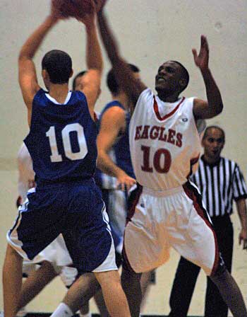 goodbballl10 Devon Carney, a first-year Eagles guard, meets his number match as both battle for possession for the ball during Saturday’s game.