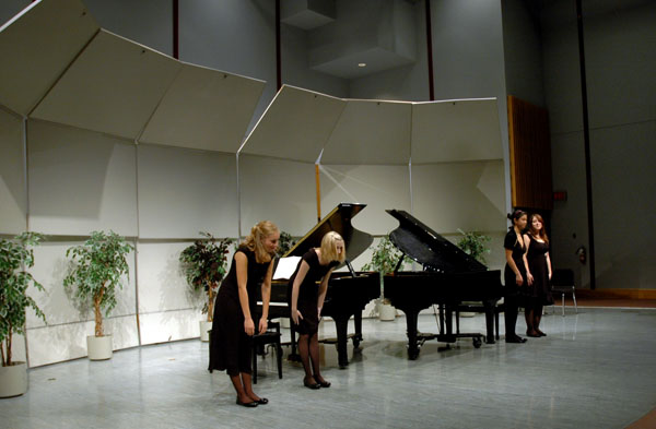 bowing Piano students Kara Routley, Elizabeth McKee, Victoria Thieu and Shauna Steger take a bow after the first movement of Schubert's Trout Quintet called Allegro vivace.
