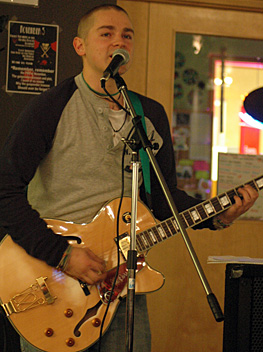 johann-full Johann Holesko sings at the second KSA-sponsored Open Mic Night at Surrey, held Nov. 5. (Cori Alfreds photo)