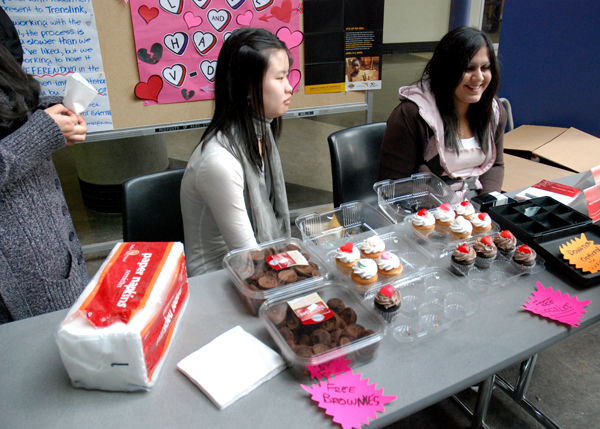 dsc_0013b KSA Richmond campus director Reena Bali and Nicole Joe hand out free brownies and cupcakes to students passing through the rotunda on Valentine's Day. (Joseph Gloria photo)