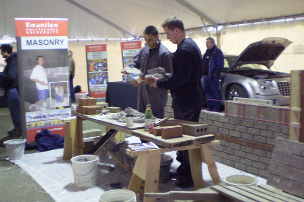 p2270124 Two masonry students show off their craft in the Trades tent at Kwantlen';s Big Big Open House.