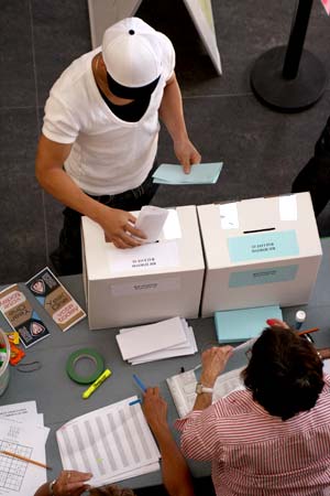 studentvoting A Kwantlen student submits his referendum ballots. Volunteers were on hand to direct students towards the voting area.