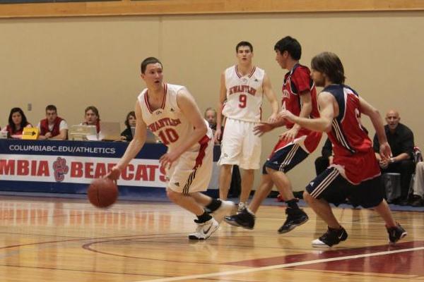 Kwantlen Eagles at Columbia Bearcats. Doug Meyers keeps the ball away from Gage Ladouceur and Sheldon Leschert of the Bearcats. (Jacob Zinn photo)