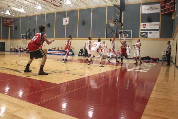 Kwantlen Eagles at Columbia Bearcats. The Eagles try to block Anderson from the net towards the end of the game. (Jacob Zinn photo)