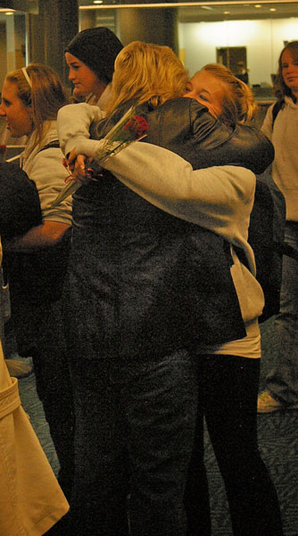 hug Christina Henderson hugs her mother at YVR after arriving home from the CCAA National tournament in Toronto.