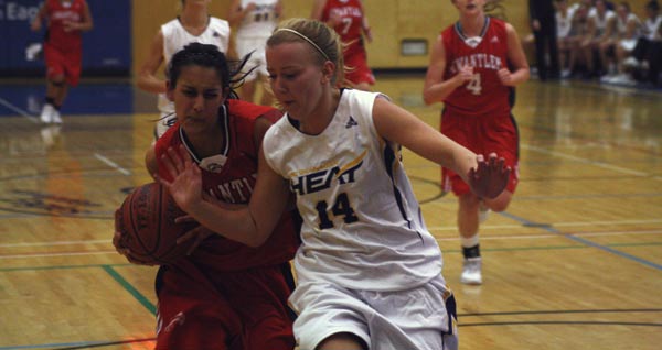 womenbb4 Taminder Dhaliwal (left) drives to the hoop against UBCO player Bailey Radley. (Mitch Thompson photo)