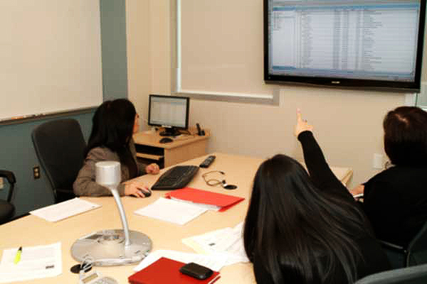 dscf0135-tix-web (Left to right) Maggie Fung, executive director of IET, Desiree Yu, public information assistant of marketing and communication, Linda Gomes, executive assistant of finance and administration, oversee Monday's Olympic ticket draw on Surrey campus. (Kirk Darbyshire photo)