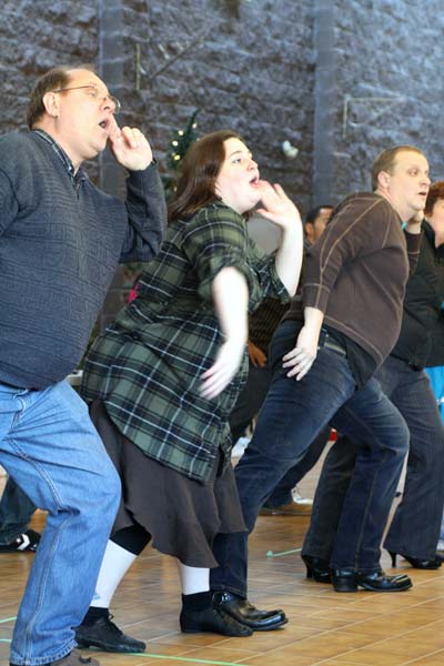 panto2 Jennifer Campbell joins her fellow actors in one of the plays many choreographed dane routines. (Katie Lawrence photo)