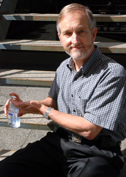 Fraser Health's chief medical health officer Dr. Roland Guasparini, chief medical health officer for Fraser Health, models the use of hand sanitizer for protection against H1N1 contraction. (Sarah Jackson photo)