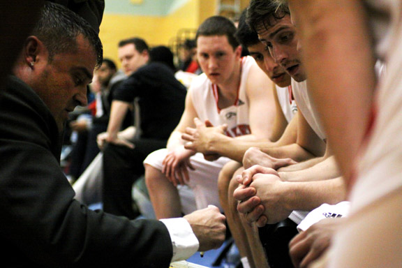 feb5-mens-time-out Seconds from the end, Coach Robbie Love draws out a play that will secure Kwantlen’s hard fought win over the Kermodes. (Justin Langille photo)