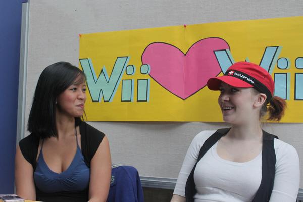 Wii Heart Wii. Ivy Mendoza and Heather Poirier ran the sign-up booth for the Wii tournament, which the KSA hopes will get Richmond students involved in recreation. (Jacob Zinn photo)