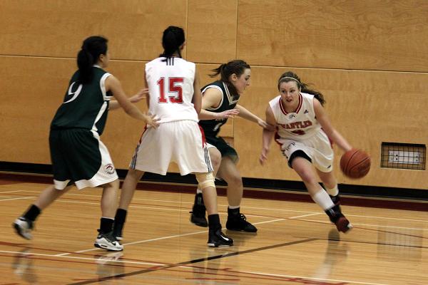 Jessica Williams drives past Jade Arignon towards the basket for two points. Jessica Williams drives past Jade Arignon towards the basket for two points.