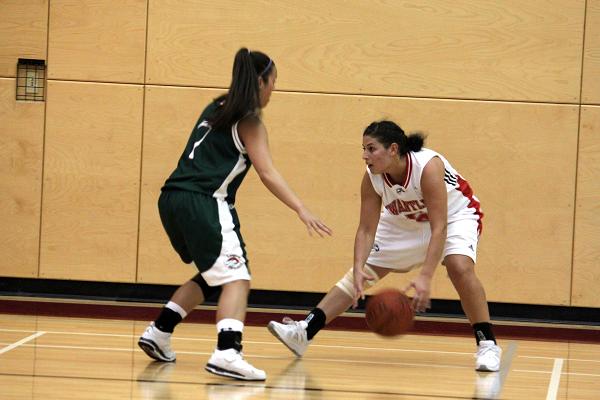 Emily Wright dribbles the ball while attempting to pass Stephanie Scott. Emily Wright dribbles the ball while attempting to pass Stephanie Scott.