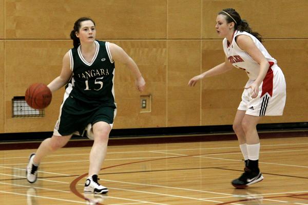 Williams keeps up the defense against Jena Riches around the three-point line. Williams keeps up the defense against Jena Riches around the three-point line.