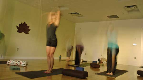 people moving at yoga